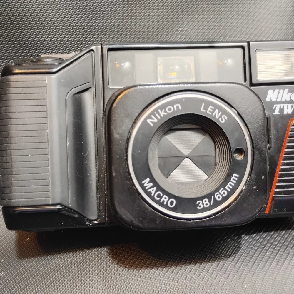 Nikon Black Camera with Gold Detail